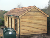 Oak cladding and cedar shingles fitted