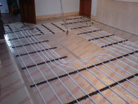 Underfloor heating pipework laid, leaving gap for central island